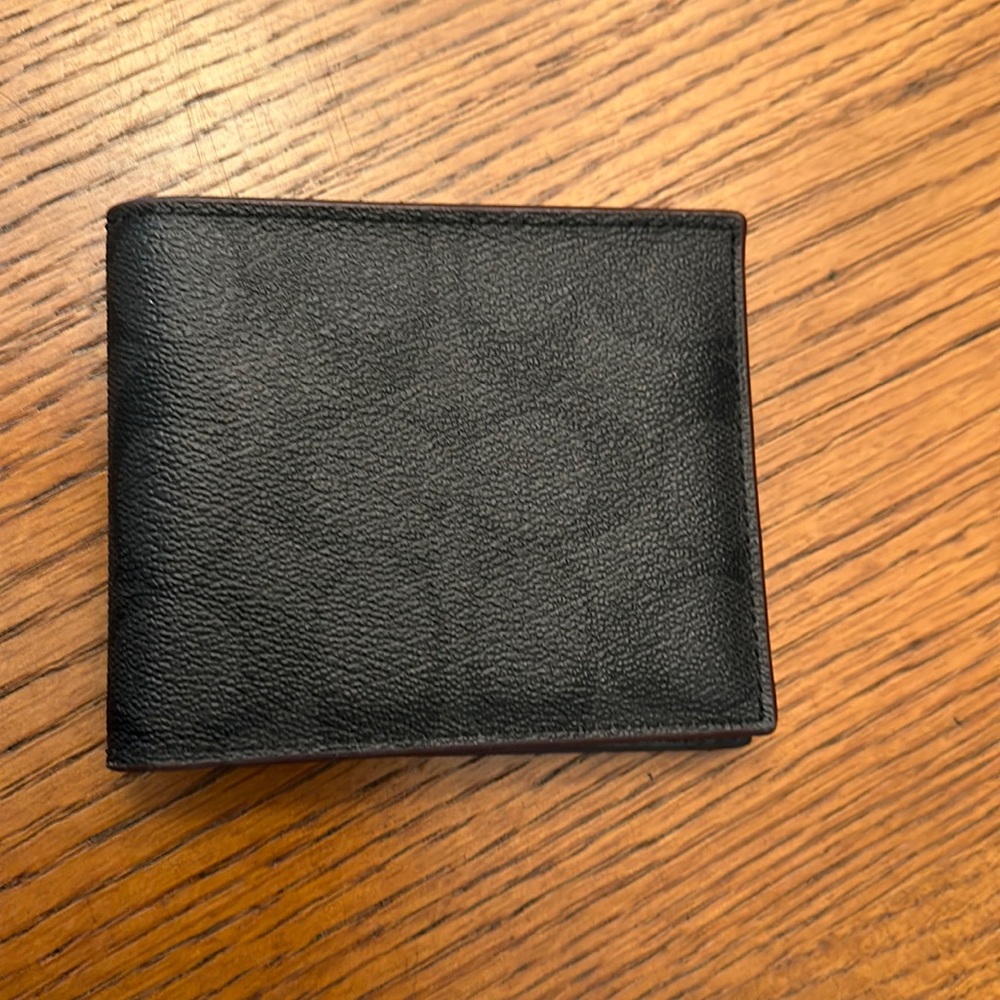 Men’s coach wallet NWOT (gift for my husband)It has never been used.